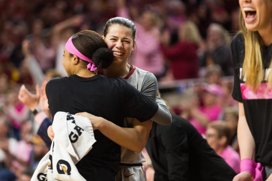 sophomore guard Nia Washington hugs Sophomore forward Adriana Camber in celebration during the Iowa State vs OSU basketball game Feb. 10 in Hilton Coliseum.The cyclones were narrowly defeated by the Cowgirls 73-81