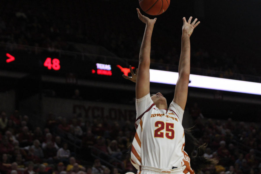 Sophomore Kristin Scott takes a shot on the basket at the game against Texas on Jan. 12.