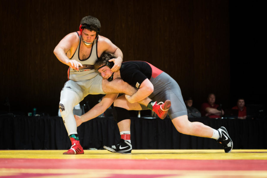 Redshirt Freshman Gannon Gremmel wrestles Tommy Helton durring the Iowa State vs SIU-Edwarsville match in Stephens Auditorium Nov. 11. The Cyclones won nine of the ten matches over the Cougars.