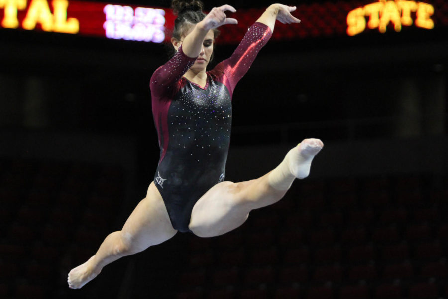 Iowa State Gymnastics junior Molly Russ executes a perfect leap on beam, earning a 9.775 for the Cyclones during the meet at Hilton Coliseum on Jan. 18.
