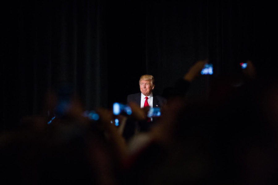 President-elect Donald Trump walks out to the stage during a rally as part of his USA Thank You Tour, in Des Moines during the evening of Dec. 8. Trump spoke about the general election, how he would repeal Obamacare, bring jobs back to the US, and reform care for veterans. 
