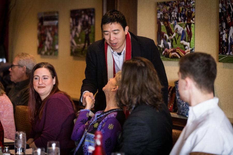 Presidential hopeful Andrew Yang shakes hands with voters before the start of his luncheon with the Story Country Democrats held at the Iowa Stater Restaurant Jan. 31. Yang said that he wanted this lunch to be an opportunity for everyone to get to know him personally.