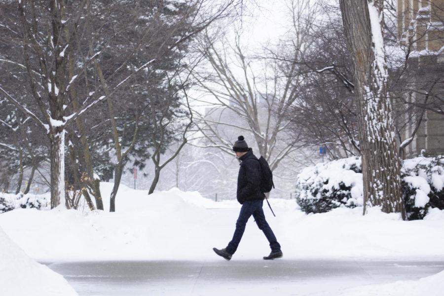 Sophomore+in+kinesiology+and+health+Ermin+Oruc+walks+on+campus+Feb.+17.+There+was+6.2%E2%80%9D+of+snow+by+the+morning+which+breaks+the+2015+snowfall+record.