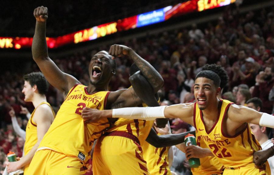 Sophomore Cameron Lard and freshman Tyrese Haliburton react with excitement after senior Zoran Talley Jr. successfully gets a rebound within the final three minutes of the second half of the game against West Virginia. The Cyclones beat West Virginia 93-68 at Hilton Coliseum on Jan. 30.