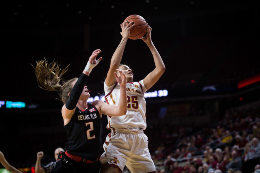 Center Kristin Scott gets a rebound during the Iowa State vs Texas Tech womens basketball game Jan. 29 in Hilton Coliseum. The Cyclones defeated the Red Raiders 105-66.