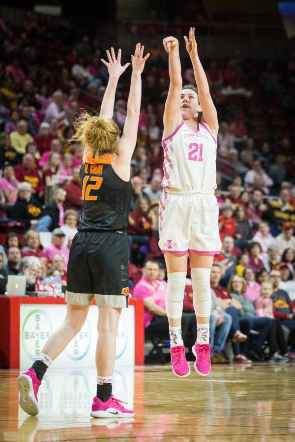 Iowa State senior guard Bridget Carleton shoots a three-pointer on Oklahoma State sophomore forward Vivian Gray during the second half of the Iowa State vs Oklahoma State women’s basketball game held in Hilton Coliseum Feb. 16. The Cyclones defeated the Cowgirls 89-67.