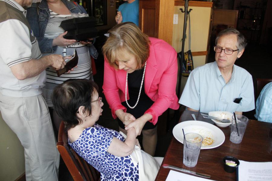 Sen. Jack Hatch, the Democratic nominee for the Iowa gubernatorial race, and Monica Vernon, his running mate, met with potential voters at Olde Main Brewing Company in Ames July 3, 2014. Vernon shakes hands with Jan Bauer, the Story County Democrat chairwoman, after the event.