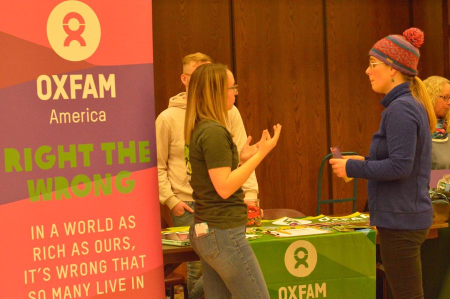 Alana Platte a senior in global resource systems talks to Allison Brundy a member of the climate action team about the Oxfam American group on campus. The group had a table at the sustainability poster session in the Great Hall of the Memorial Union. The event was held at 5:30 p.m. Tuesday. 