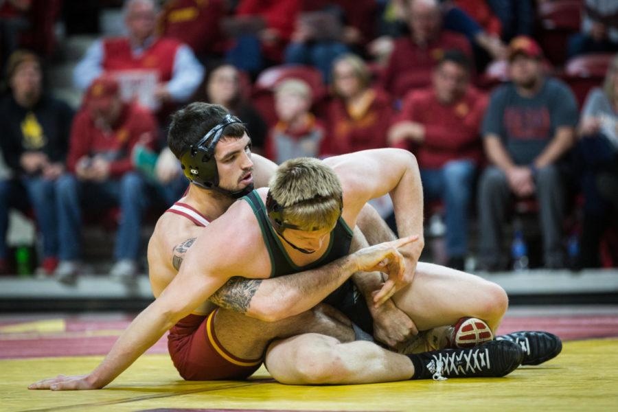 Redshirt senior Willie Miklus wrestles redshirt freshman Ashton Seely during the Iowa State vs Utah Valley dual meet Feb. 3 in Hilton Coliseum. Miklus won by major decision 17-6 and the Cyclones defeated the Wolverines 53-0.