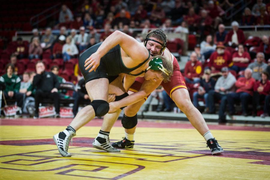 Redshirt sophomore Gannon Gremmel takes down redshirt freshman Tate Orndorff during the heavy weight matchup of the Iowa State vs Utah Valley dual meet Feb. 3 in Hilton Coliseum. Gremmel won by fall at 6 minutes and 31 seconds and the Cyclones defeated the Wolverines 53-0 overall.