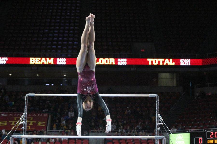 Iowa State Gymnastics freshman Natalie Horowitz completes a bail transition to the low bar during her routine, and earns a 9.700 for the Cyclones during the meet against Lindenwood University at Hilton Coliseum on Jan. 27.