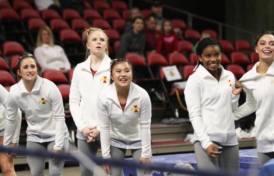Members of the Iowa State Gymnastics team watch intently as Sydney Converse competes on the bars during the meet against Southern Utah University at Hilton Coliseum on Feb. 8. Converse scored a 9.800 during the bars competition. Iowa State won with an all-around score of 195.375, beating out Southern Utah with a score of 195.250. Iowa State had higher scores then Southern Utah in vault, bars, beam and floor.