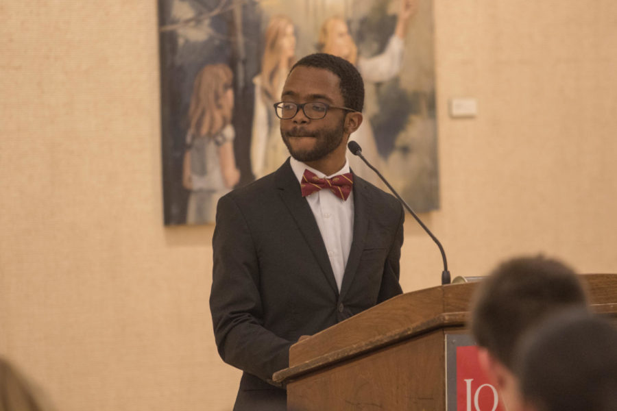 Benjamin Whittington, candidate for student body president, answers a question at the debate Feb. 26, 2018.