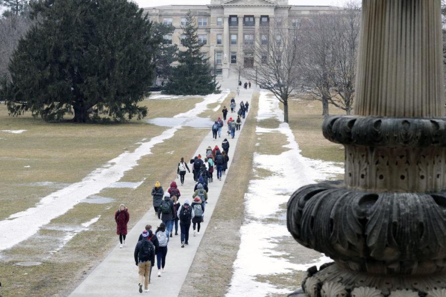 Iowa State students walk to class on Feb. 4. After a weekend of temperatures in the 40 degrees the high for the day was 26 degrees and the low was 8 degrees.