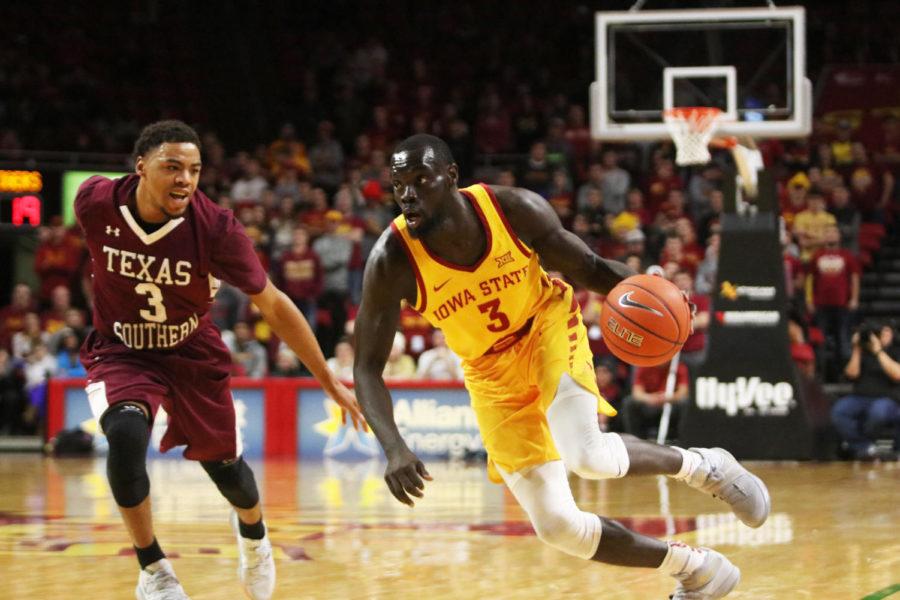 Redshirt senior Marial Shayok runs the ball past Texas Southern senior Jalyn Patterson during the game against Texas Southern at Hilton Coliseum on Nov. 12. The Cyclones won 85-73.