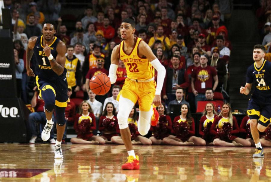 Iowa State freshman Tyrese Haliburton runs down the court followed by West Virginia freshman Derek Culver (left) and junior Chase Harler (right) in the second half during the game at Hilton Coliseum on Jan. 30. The Cyclones won 93-68.