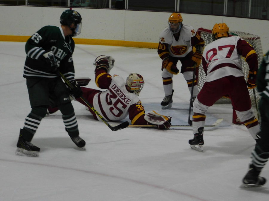 Matt Goedeke, goalkeeper for the cyclones, trying to slide back to his feet after a huge save against the Ohio Bobcats at the Iowa State Ice Arena on Oct. 19. The Cyclones ended up losing 4-1 to the Bobcats.