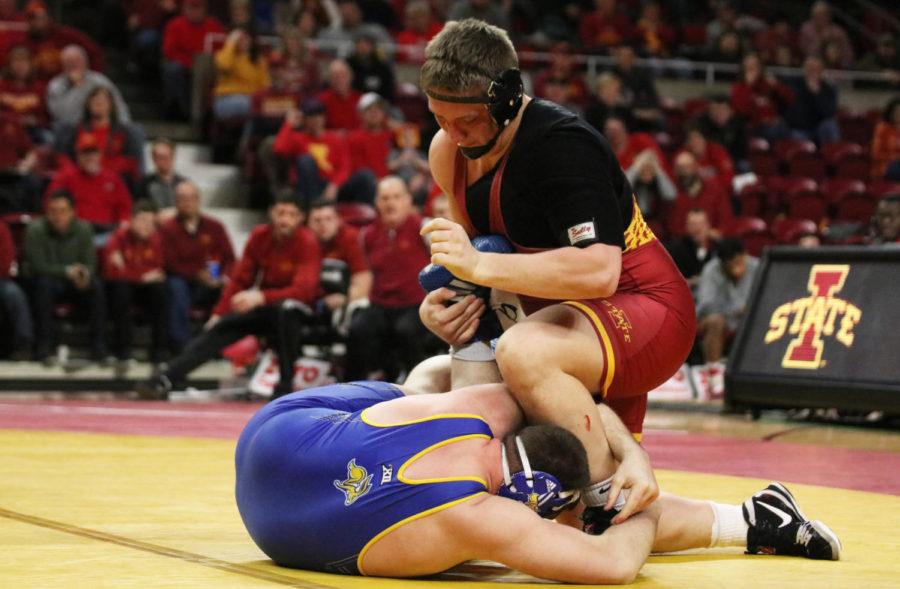 Iowa State redshirt sophomore Gannon Gremmel takes on South Dakota State redshirt sophomore Blake Wolters as a part of the 285-pound weight class during the second period of their match at Hilton Coliseum on Feb. 1. Gremmel won the match up. The Iowa State wrestling team won 47-0 against South Dakota State.