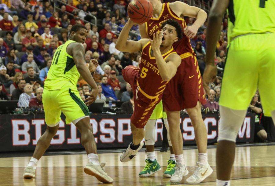 Iowa State sophomore Lindell Wigginton attempts a shot after being tripped by a Baylor defender during the second half. Wigginton and the Cyclones defeated the Bears, 83-66.