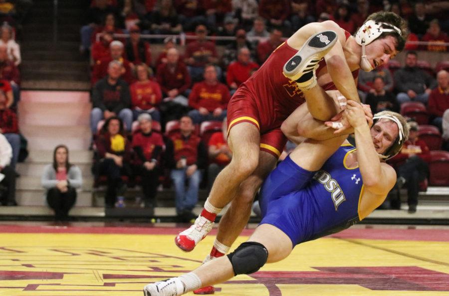 Iowa State then-redshirt junior Chase Straw takes on South Dakota State then-sophomore Colten Carlson as a part of the 157-pound weight class during the first period of their match at Hilton Coliseum on Feb. 1, 2019. Straw won the matchup. The Iowa State wrestling team won 47-0 against South Dakota State.