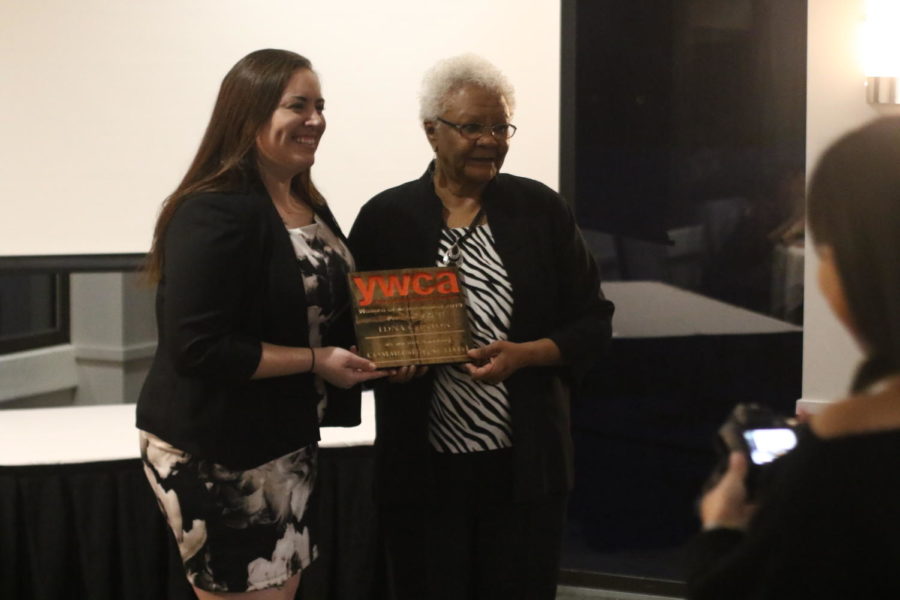 Edna Clinton, Ames NAACP President, receives an award at the YWCA awards banquet on Thursday.