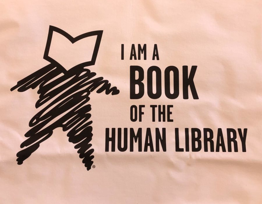 The logo of the shirts that human books will be wearing during the human library event where students will be telling their stories to attendees who check out the human books.