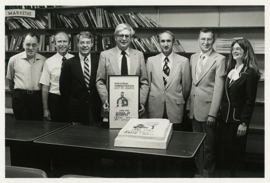 ca. 1981. From left to right: Martin Zober, Gary Aitchison, Chuck Millar (former chair of management), Charles Handy (founding dean), Ken Elvik (former chair of accounting), Lee Hoover (former chair of finance) and Linda (Tausz) Ferguson (administrative assistant).