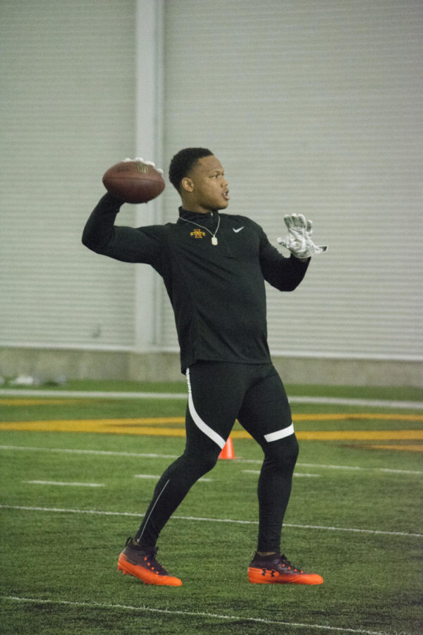 Former running back David Montgomery practices throwing and catching March 26 during Pro Day at Bergstrom Football Complex.