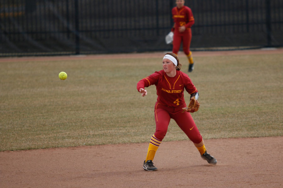 Iowa State second baseman Sydney Stites flips the ball to Sami Williams during the Cyclones 11-4 loss to Texas at the Cyclone Sports Complex.