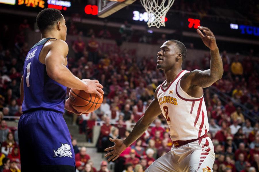 Iowa State sophomore forward Cameron Lard guards TCU junior guard Desmond Bane while he attempts to inbound the ball during the second half of the Iowa State vs TCU men’s basketball game held Feb. 9 in Hilton Coliseum. The Horned Frogs defeated the Cyclones 92-83 despite a surge from Iowa State in the last quarter.