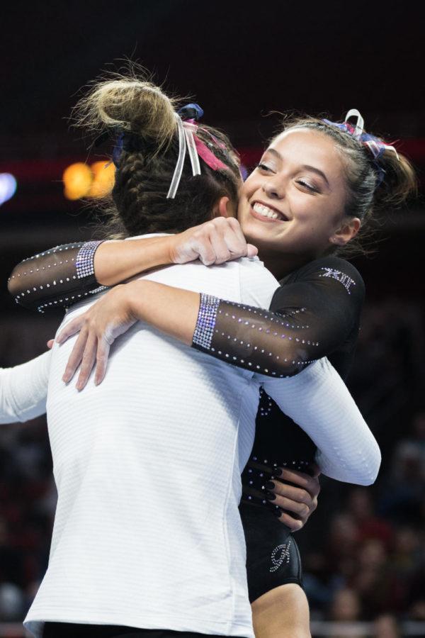 Iowa+State+freshman+Grace+Woolfolk+hugs+her+teammate+following+a+stuck+landing+on+beam+during+the+third+rotation+of+the+Iowa+State+vs+Oklahoma+gymnastics+meet.+The+No.+23+ranked+Cyclones+were+defeated+by+the+No.+1+ranked+Sooners+196.275-197.575.