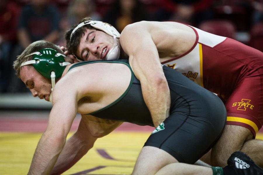 Then-redshirt junior Chase Straw gets a takedown against then-redshirt freshman Spencer Heywood during the first match of the Iowa State vs. Utah Valley dual-meet Feb. 3 in Hilton Coliseum. Straw won by major decision 4-0, and the Cyclones defeated the Wolverines 53-0.
