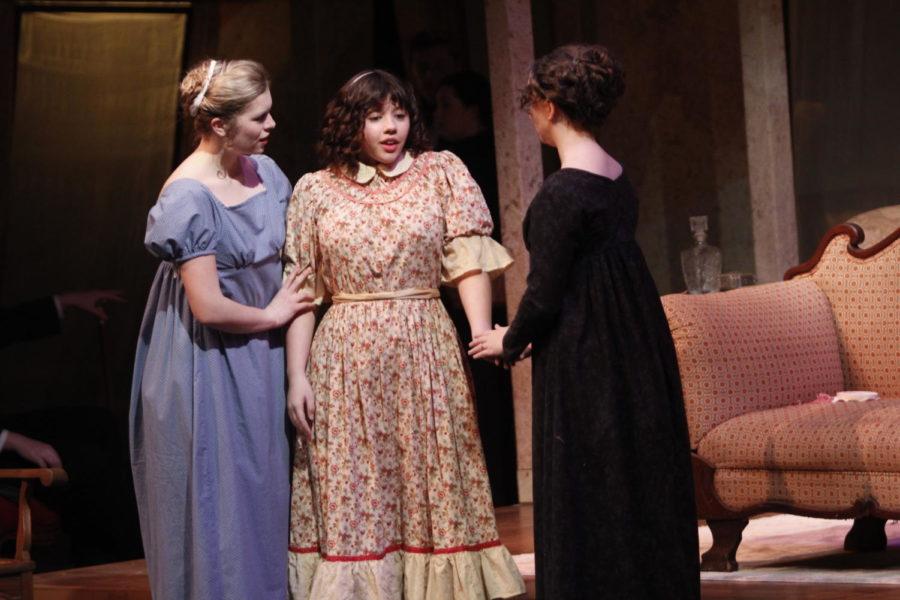 Olivia Griffith as Elinor Dashwood (left), Isabella Witte as Margaret Dashwood (middle), and Alyson OHara as Mrs. Dashwood (right) get into character on Feb. 20 during the dress rehearsal of Sense and Sensibility. Witte stars in the play, despite her status as a non-performing arts major. 