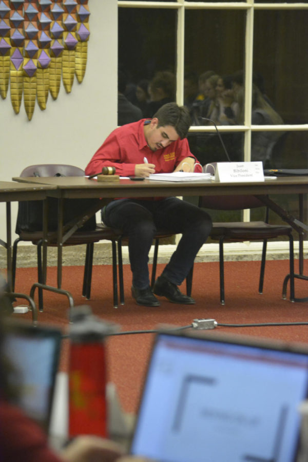 Juan Bibiloni, Student Government vice president, takes notes during the student government meeting on Oct. 24 in the Campanile room of the Memorial Union. The meeting centered on funding for Latinx Initiatives, Rodeo Club, seating at-large members to the finance committee and confirming members to the election commission.