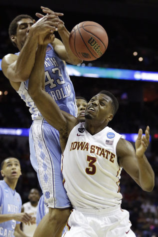 Senior forward Melvin Ejim and North Carolinas James Michael McAdoo fight for a loose ball during Iowa States 85-83 win over North Carolina on March 23 at the AT&T Center in San Antonio.