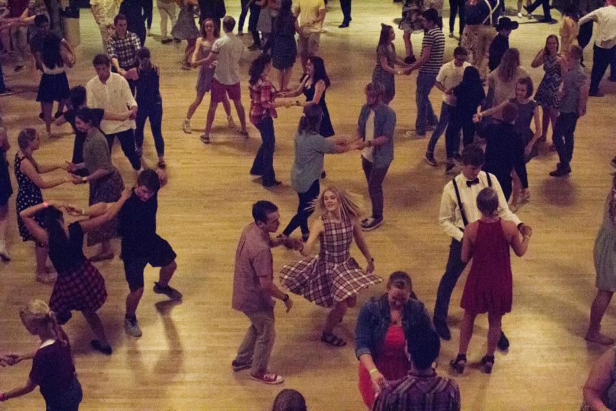 Dance partners swing dance Sept. 7, 2018, in the Great Hall of the Memorial Union. Swing dancing lessons were held the first half hour, and attendees were able to freestyle to live music.