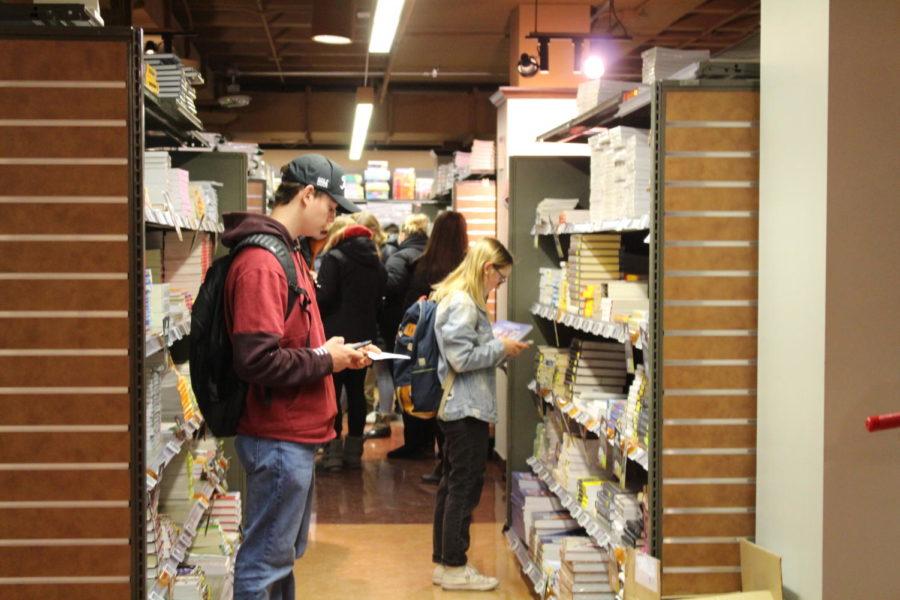 Students pick up books for the upcoming semester Jan. 14 at the Iowa State University bookstore.