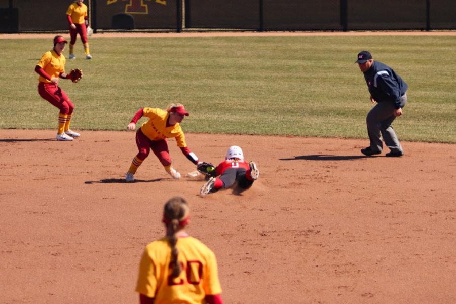 Second baseman Kasey Simpson tries to tag Texas Tech senior Jessica Hartwell during Iowa States loss to Texas Tech, but Hartwell is called safe. Iowa State lost to Texas Tech 8-4 on March 31, dropping their record to 18-15 overall and 1-5 in Big 12 play. 
