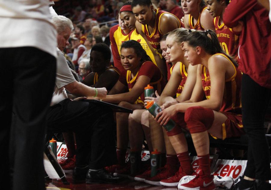 Members of the Iowa State women’s basketball team meet with Coach Bill Fennelly in between quarters during the game against the Winona State Warriors at Hilton Coliseum on Nov. 4. The Cyclones won 73-39.
