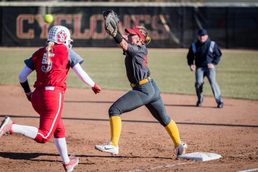 Iowa State senior first basemen Sally Woolpert reaches for the ball during the Iowa State vs South Dakota softball game held at the Cyclone Sports Complex April 2. The Cyclones had three home run hits and defeated the Coyotes 9-1.