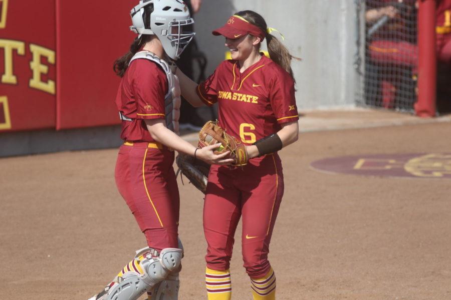 Iowa State junior Logan Schaben is congratulated by her teammate after making a catch during their game against UNI on Tuesday, April 16. The Cyclones defeated the Panthers, 2-0.