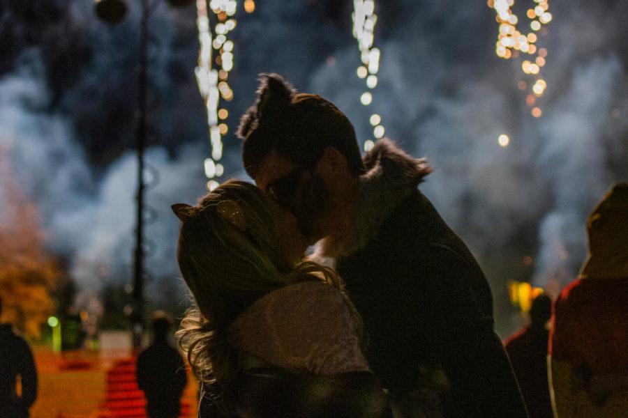 Students kiss under the fireworks on campus at midnight on Oct. 27 for Mass Campaniling, a long-standing Iowa State tradition, during Homecoming 2018.