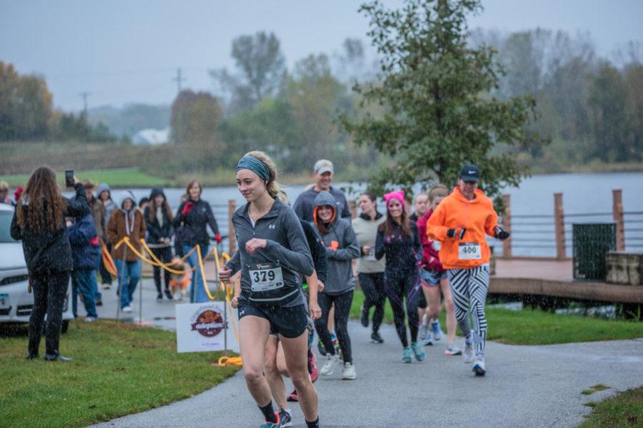 Runners starting out in the rain at the Gingerbread 5K on Sunday Oct. 7.