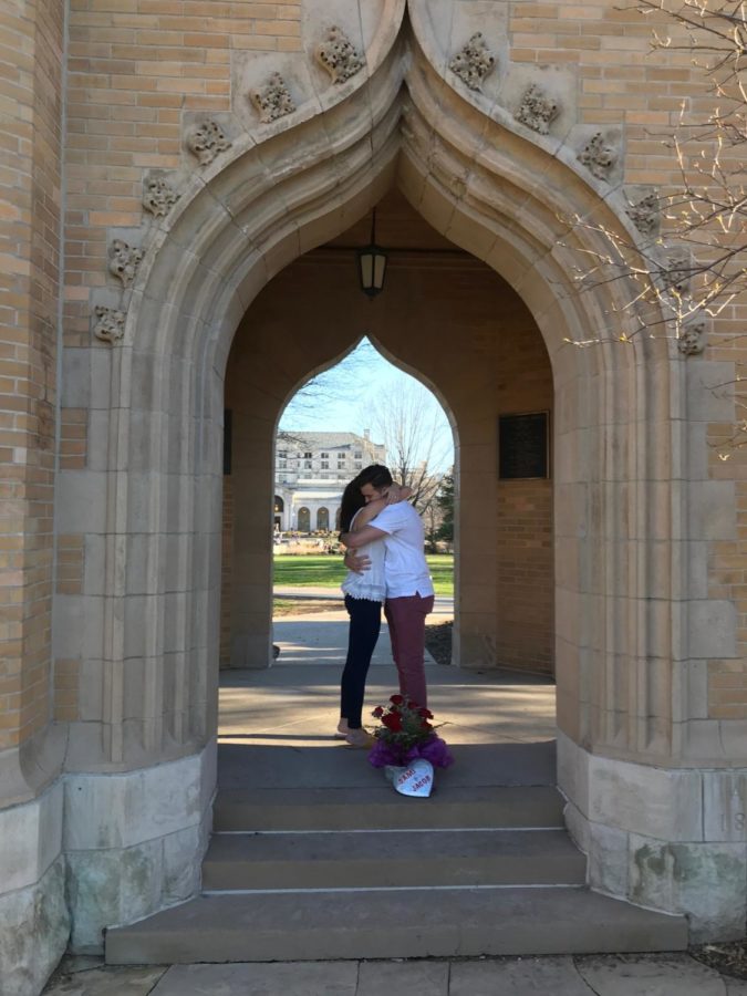 Jake Gallaher and Sami McCool hugging after Gallaher proposed under the Campanile. 