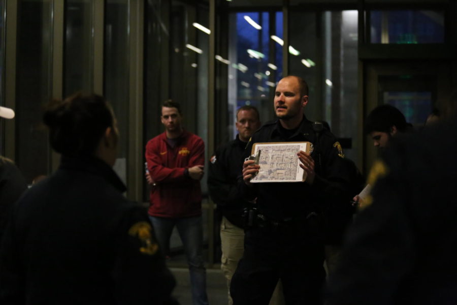 Community Resource Officer Kurt Kruger shows a map of the place the volunteers and staff would be walking at the annual Campustown safety walk. The purpose of the walk was to identify the safety hazards around campustown. The walk was hosted by the city of Ames and Ames Police department Wednesday, Apr. 17.