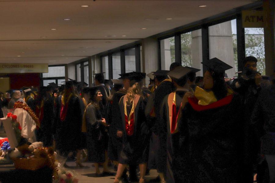 Graduates+wait+in+the+atrium+of+Hilton+Coliseum+for+the+Spring+2019+Graduate+Commencement+to+begin+on+May+9.+The+ceremony+was+for+students+graduating+with+a+Master+or+PhD+degree.