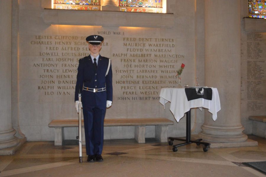A member of the Iowa State Air Force ROTC stands guard in the Gold Star Hall of Memorial Union to honor missing in action, and prisoners of war on POW/MIA day. 