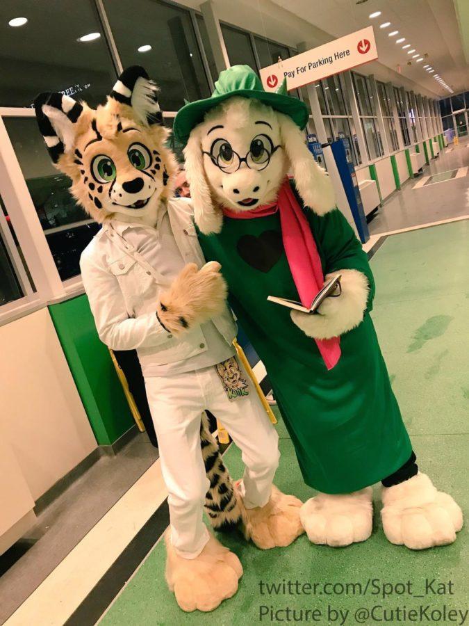 An+Iowa+State+student%2C+Kook+in+a+fursuit%2C+a+serval+cat%2C+and+their+partner+an+ISU+alumni%2C+dressed+as+the+goat+Ralsei+from+Deltarune.