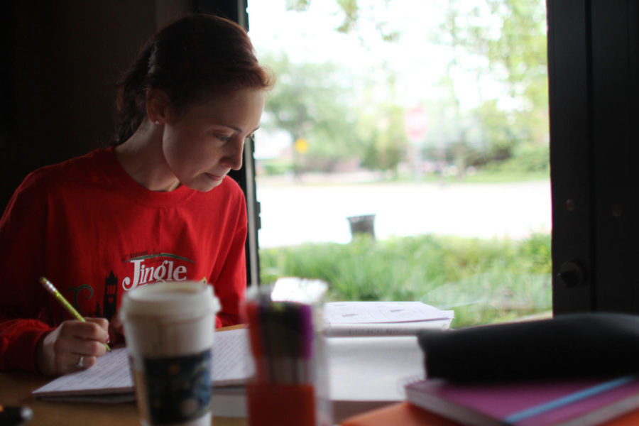 Francesca Johnson, Junior in Psychology minor in statistics, studies for her summer classes on Wednesday June 6th at Stomping Grounds.
