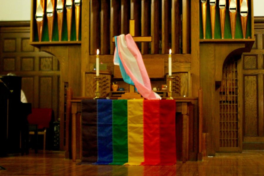The+Ames+United+Church+of+Christ+calls+themselves+a+theologically+progressive+church%2C+they+held+a+candlelight+vigil+with+this+pride+banner+for+those+affected+by+the+June+13%2C+2016+Orlando+nightclub+shooting.+A+pride+banner+emblazoned+with+the+words+God+is+Still+Speaking%2C+which+hung+outside+the+AUCC%2C+was+lit+aflame+Tuesday+morning.